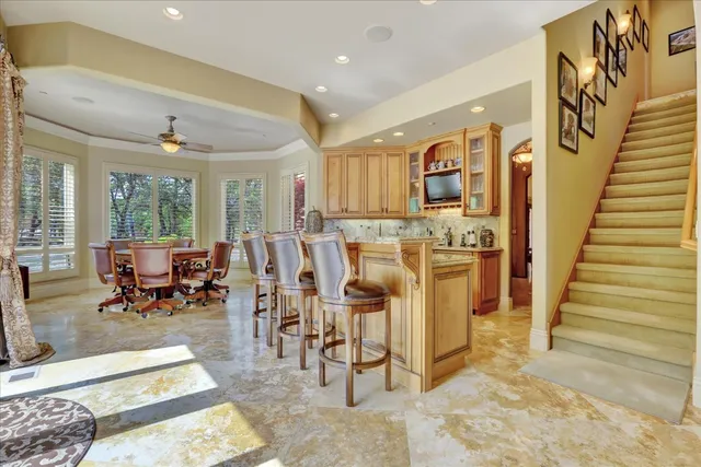 a media room with lots of chairs and a projector screen