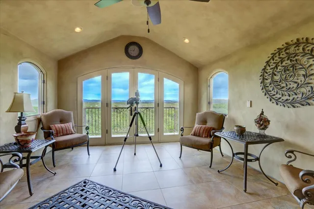 a front view of a house with fountain bath tub and trees