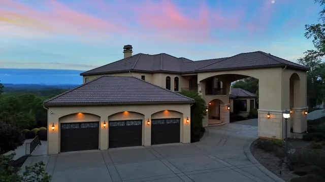 a front view of a house with swimming pool