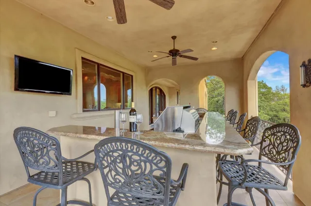 a view of a fountain in the backyard of house
