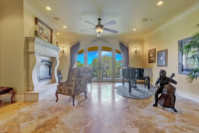 a living room with a fireplace and a rug