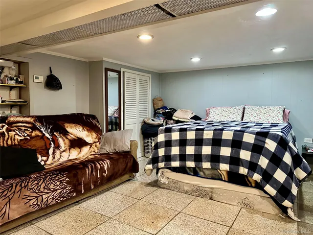 a bedroom with two beds and a walk in closet