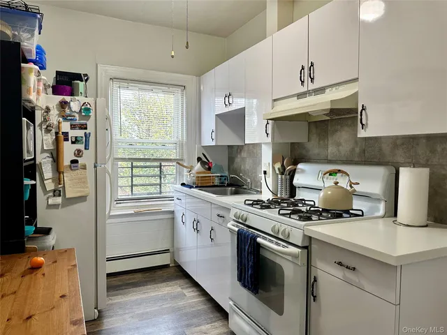 a kitchen with stainless steel appliances granite countertop a stove and a sink