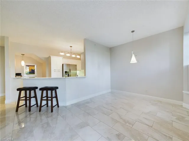 a view of kitchen with furniture and window