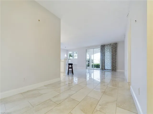 a view of a livingroom with a dinning table and chair