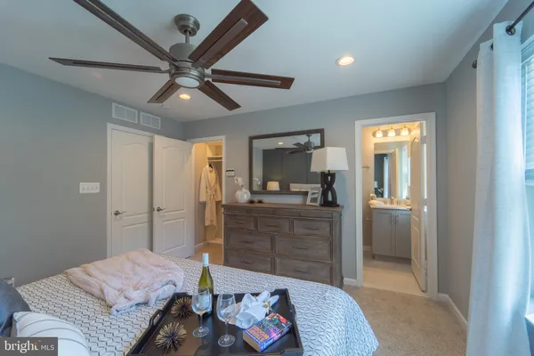 a room with a bed and furniture