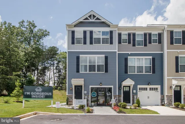 a front view of a building and a yard