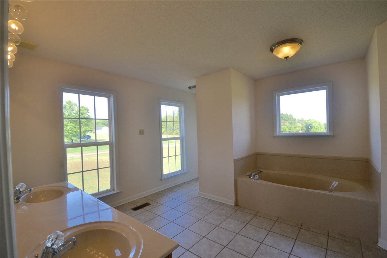 24 Phillips Road Brighton, TN 38011 - Photo 11 of 23 his/her closets with dual sinks, whirlpool tub & separate shower