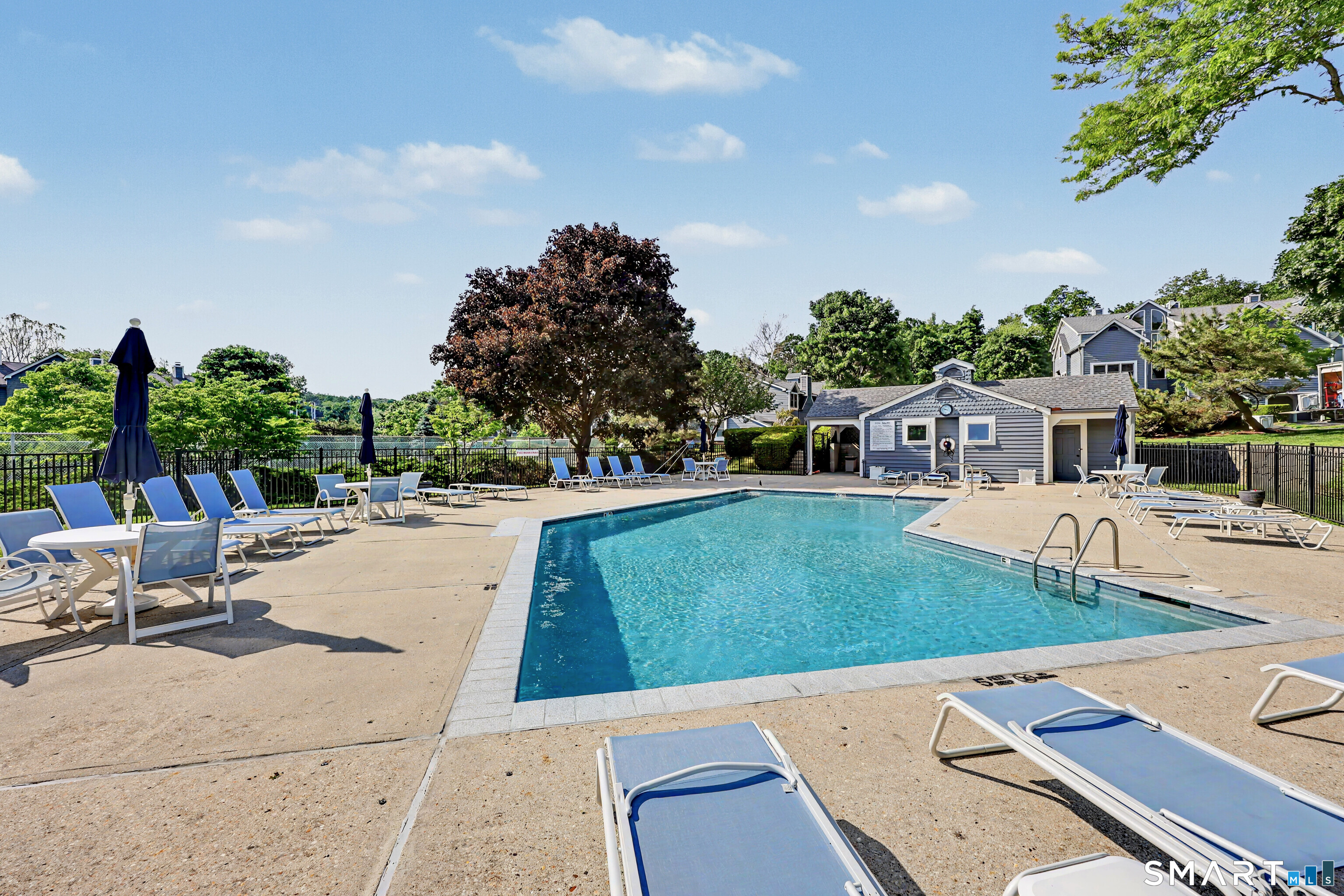 70 Fawn Ridge Lane, Unit 70 Norwalk, CT 06851 - Photo 32 of 36 a view of an outdoor space and swimming pool