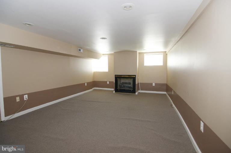 1542 Chain Bridge Road McLean, VA 22101 - Photo 14 of 22 Family room with gas fireplace