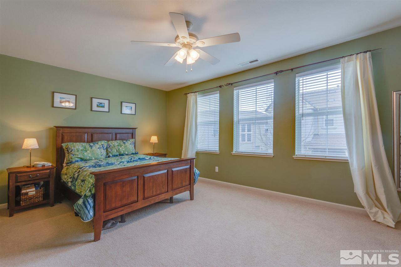 7660 Stone Bluff Way Reno, NV 89523 - Photo 14 of 22 a bedroom with a bed and window