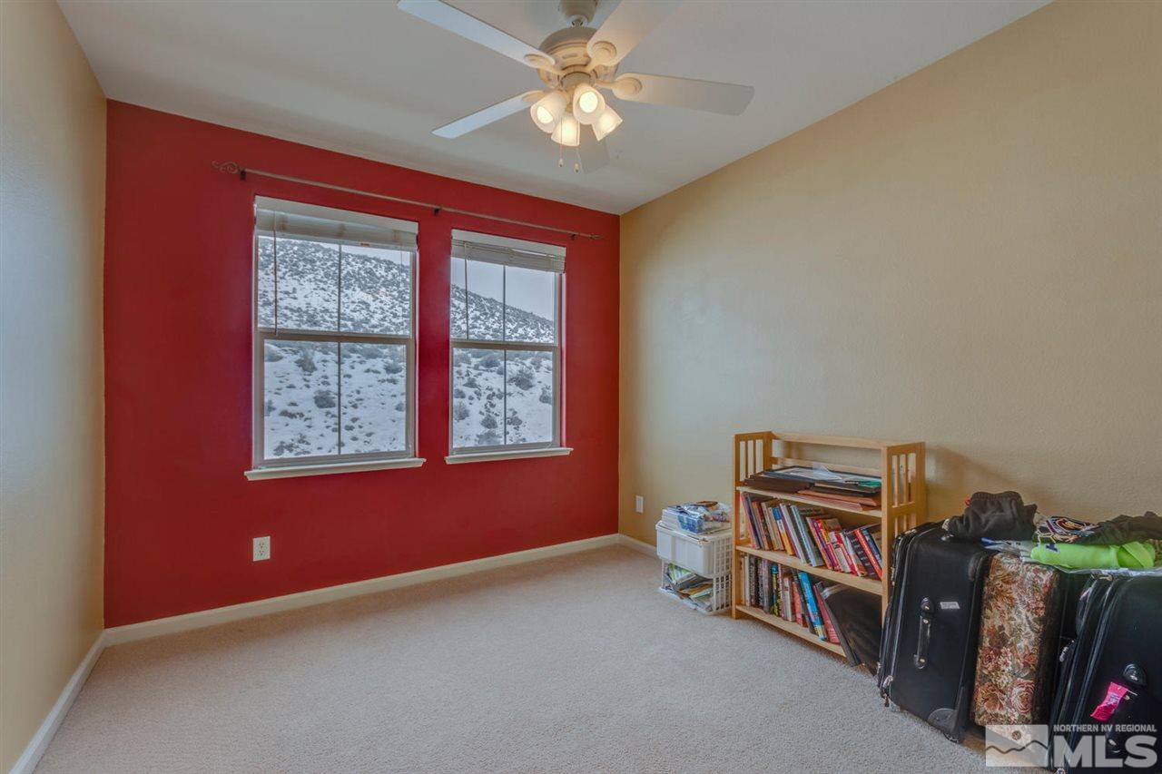 7660 Stone Bluff Way Reno, NV 89523 - Photo 17 of 22 a room with furniture and a window