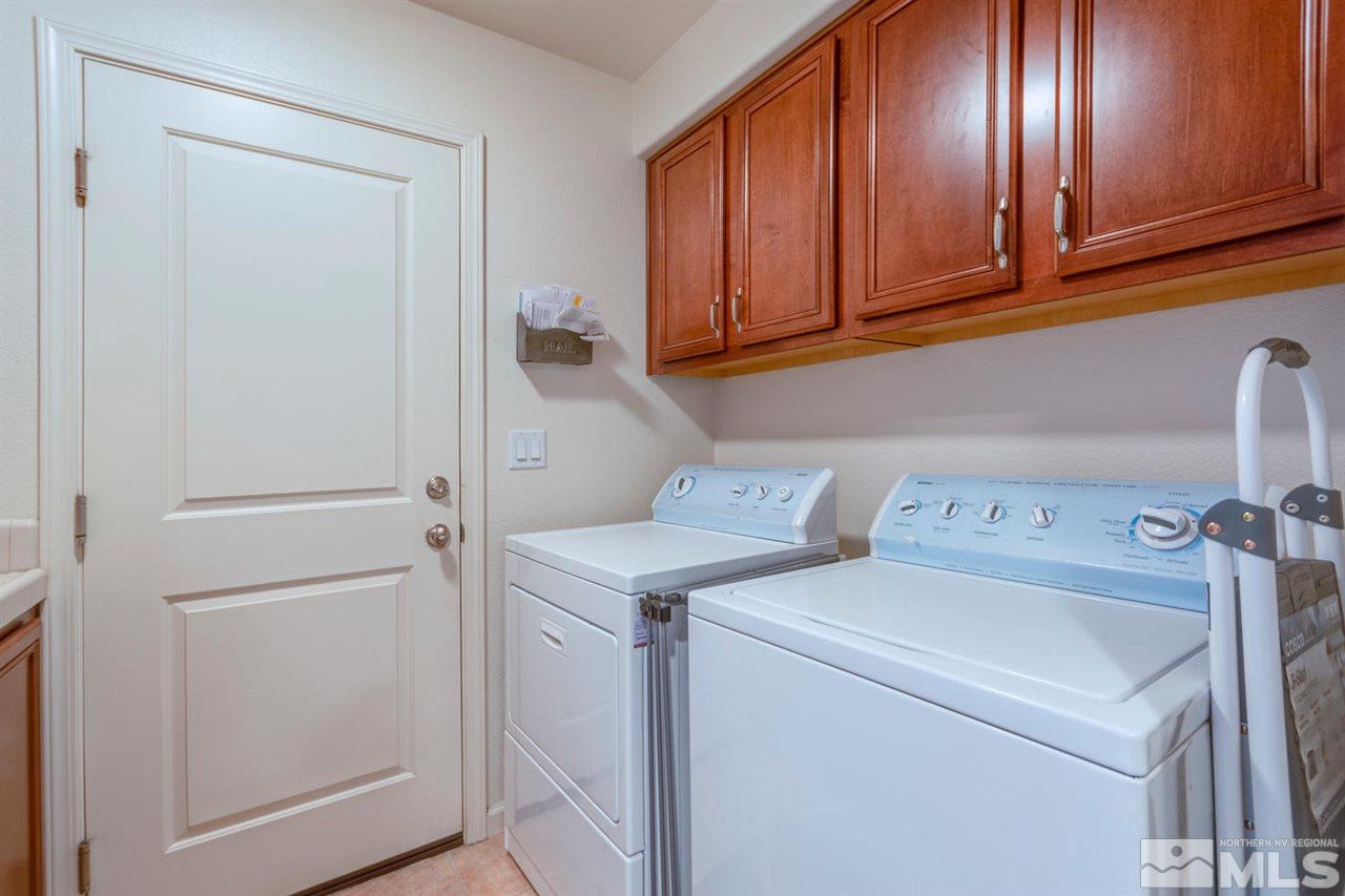 7660 Stone Bluff Way Reno, NV 89523 - Photo 20 of 22 a view of storage and utility room with washer and dryer