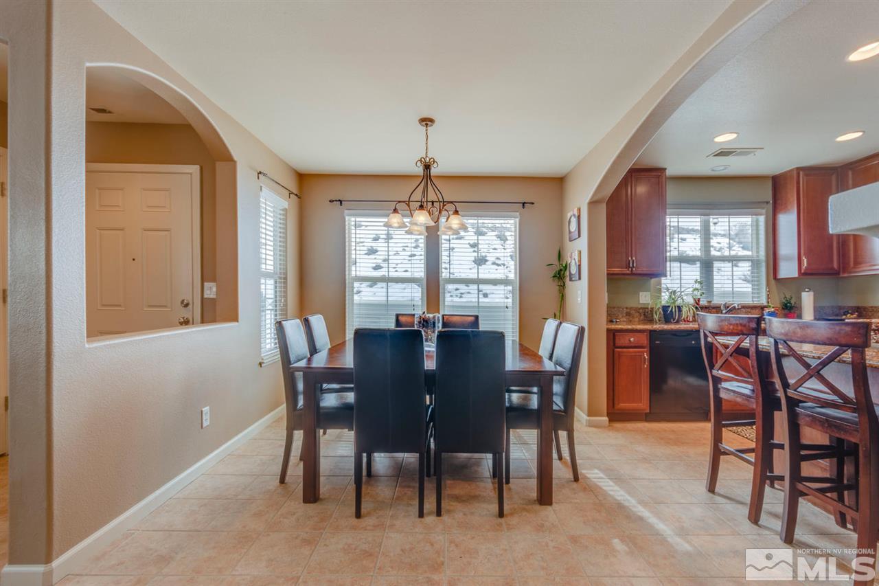 7660 Stone Bluff Way Reno, NV 89523 - Photo 3 of 22 a view of a dining room with furniture window and outside view