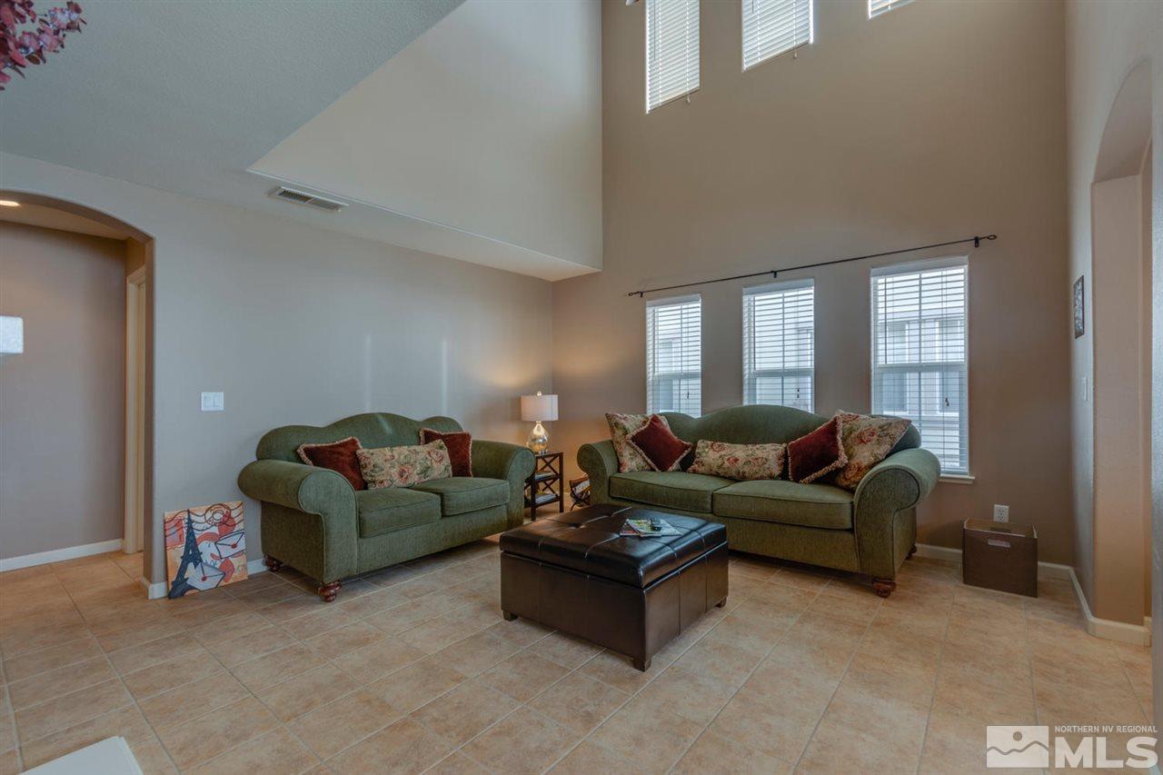 7660 Stone Bluff Way Reno, NV 89523 - Photo 8 of 22 a living room with furniture and a window