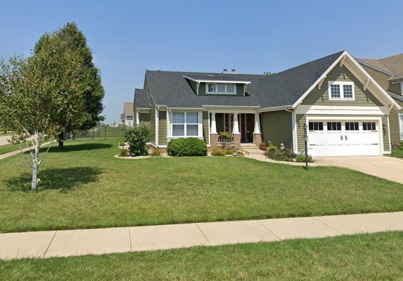 3912 Boulder Ridge Drive Champaign, IL 61822 - Photo 1 of 1 a front view of a house with a yard