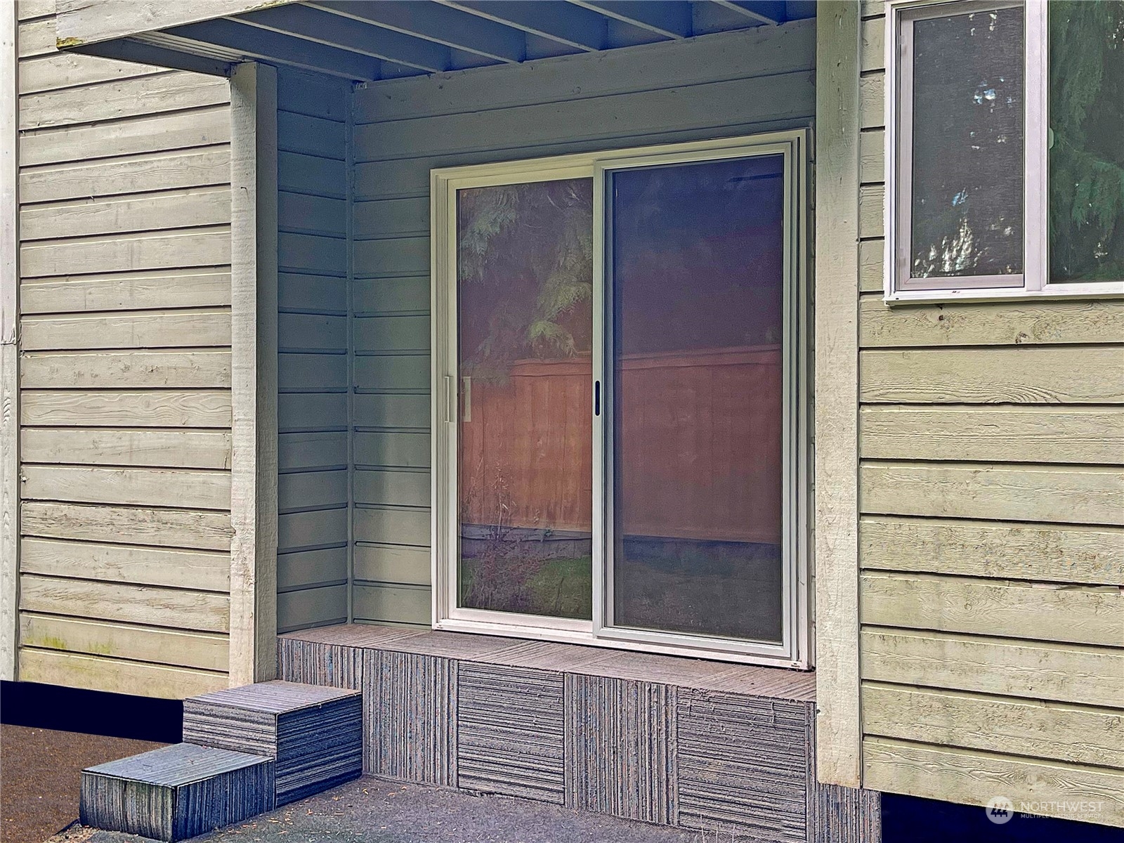 14401 Southeast Petrovitsky Road, Unit D105 Renton, WA 98058 - Photo 19 of 25 a view of door of a house with a large windows