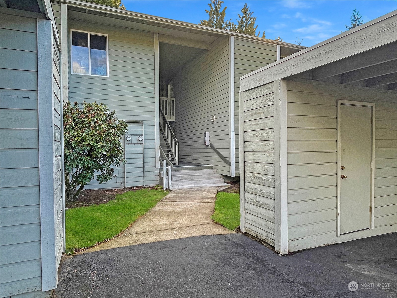 14401 Southeast Petrovitsky Road, Unit D105 Renton, WA 98058 - Photo 2 of 25 a front view of a house with a yard