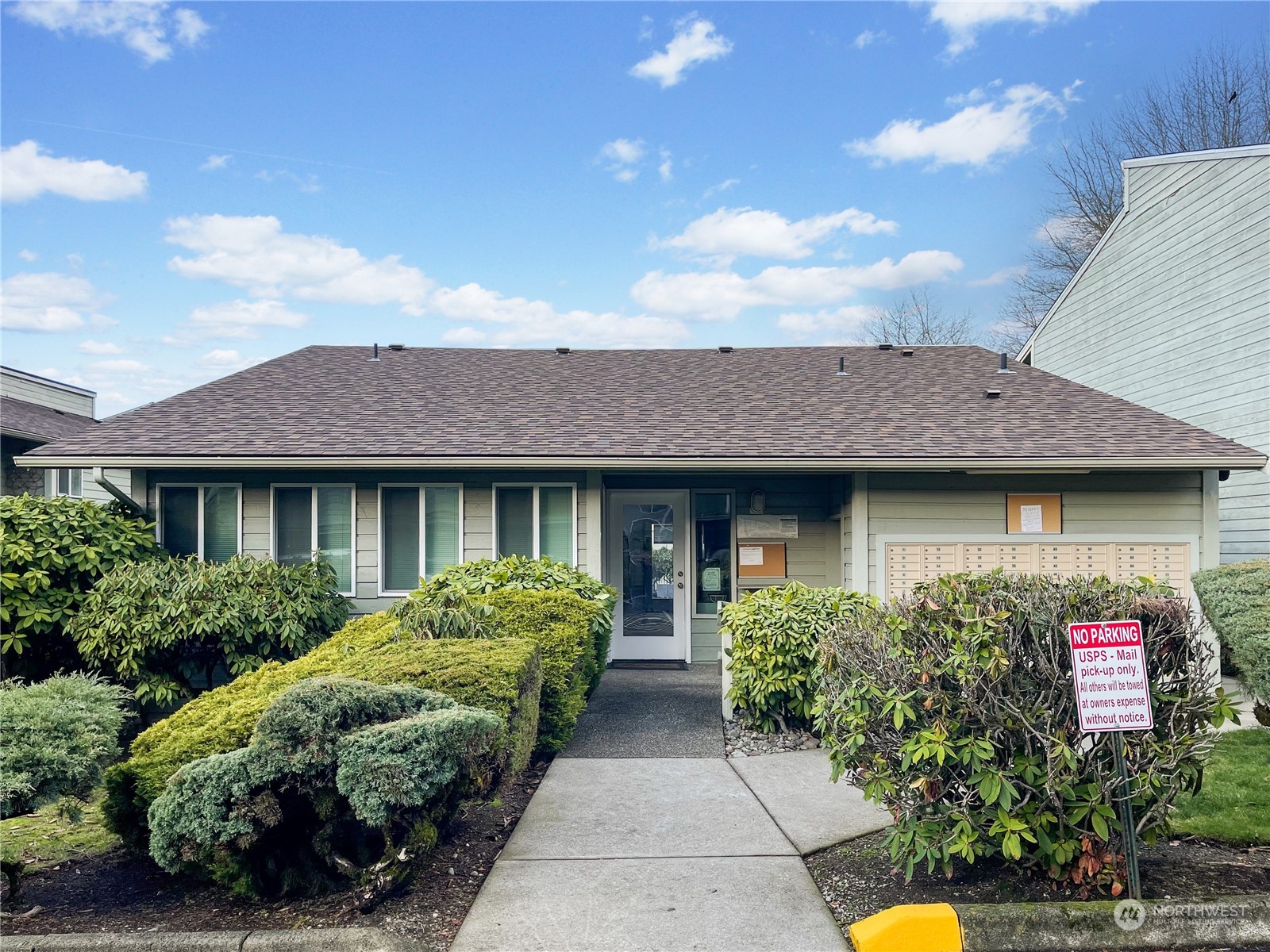 14401 Southeast Petrovitsky Road, Unit D105 Renton, WA 98058 - Photo 24 of 25 a front view of a house with garden