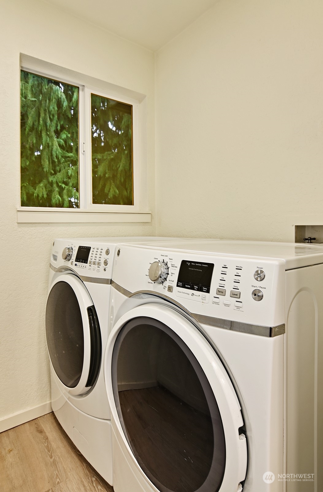 14401 Southeast Petrovitsky Road, Unit D105 Renton, WA 98058 - Photo 9 of 25 a utility room with dryer and washer