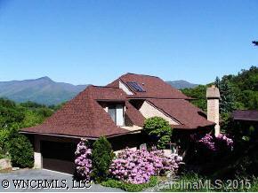 40 Wolfpen Road Waynesville, NC 28786 - Photo 2 of 9 a view of a house with a yard and garden