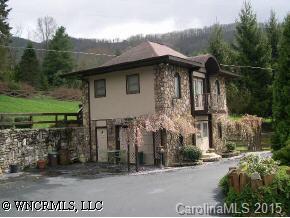 40 Wolfpen Road Waynesville, NC 28786 - Photo 6 of 9 a front view of a house with a garden