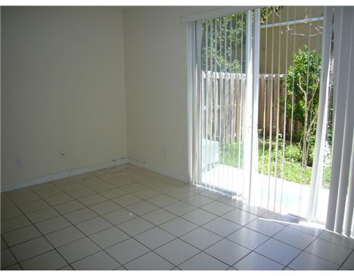 15630 Southwest 40th Street, Unit 192 Miramar, FL 33027 - Photo 4 of 10 a view of an empty room and window