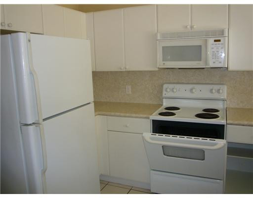 15630 Southwest 40th Street, Unit 192 Miramar, FL 33027 - Photo 5 of 10 a stove top oven sitting inside of a kitchen