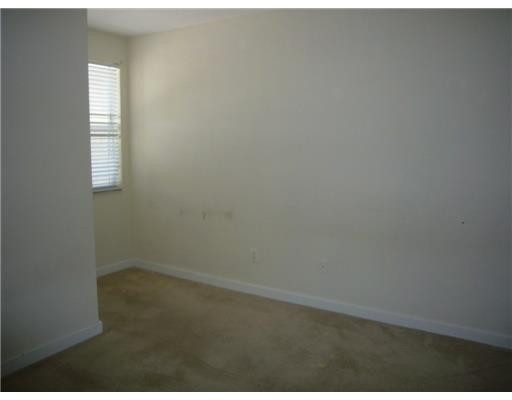 15630 Southwest 40th Street, Unit 192 Miramar, FL 33027 - Photo 6 of 10 an empty room with a window