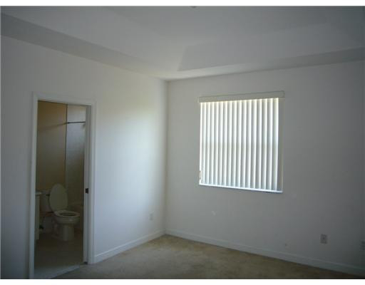 15630 Southwest 40th Street, Unit 192 Miramar, FL 33027 - Photo 8 of 10 an empty room with windows