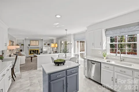 a kitchen with a sink stove and cabinets