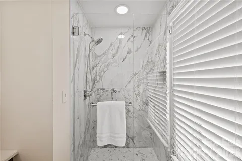 a bathroom with a shower curtain and a sink