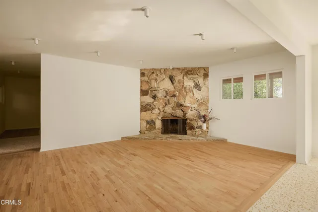 a view of an empty room with a window