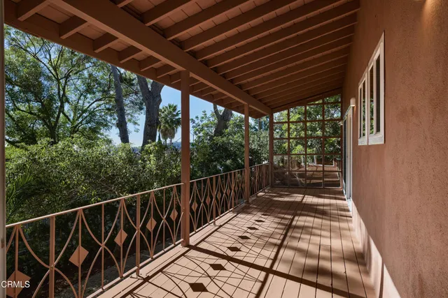 a view of balcony with wooden floor