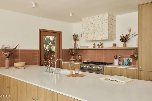 a kitchen with a sink and cabinets