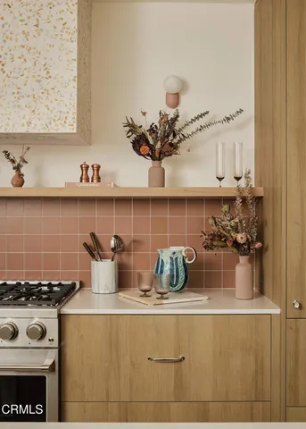 a kitchen with a stove and cabinets