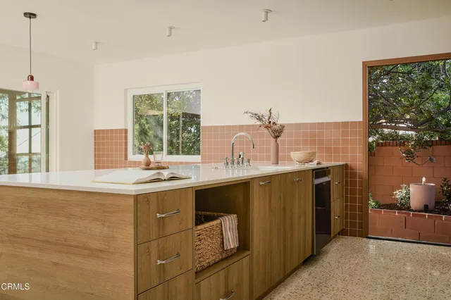 a kitchen with a sink and a window