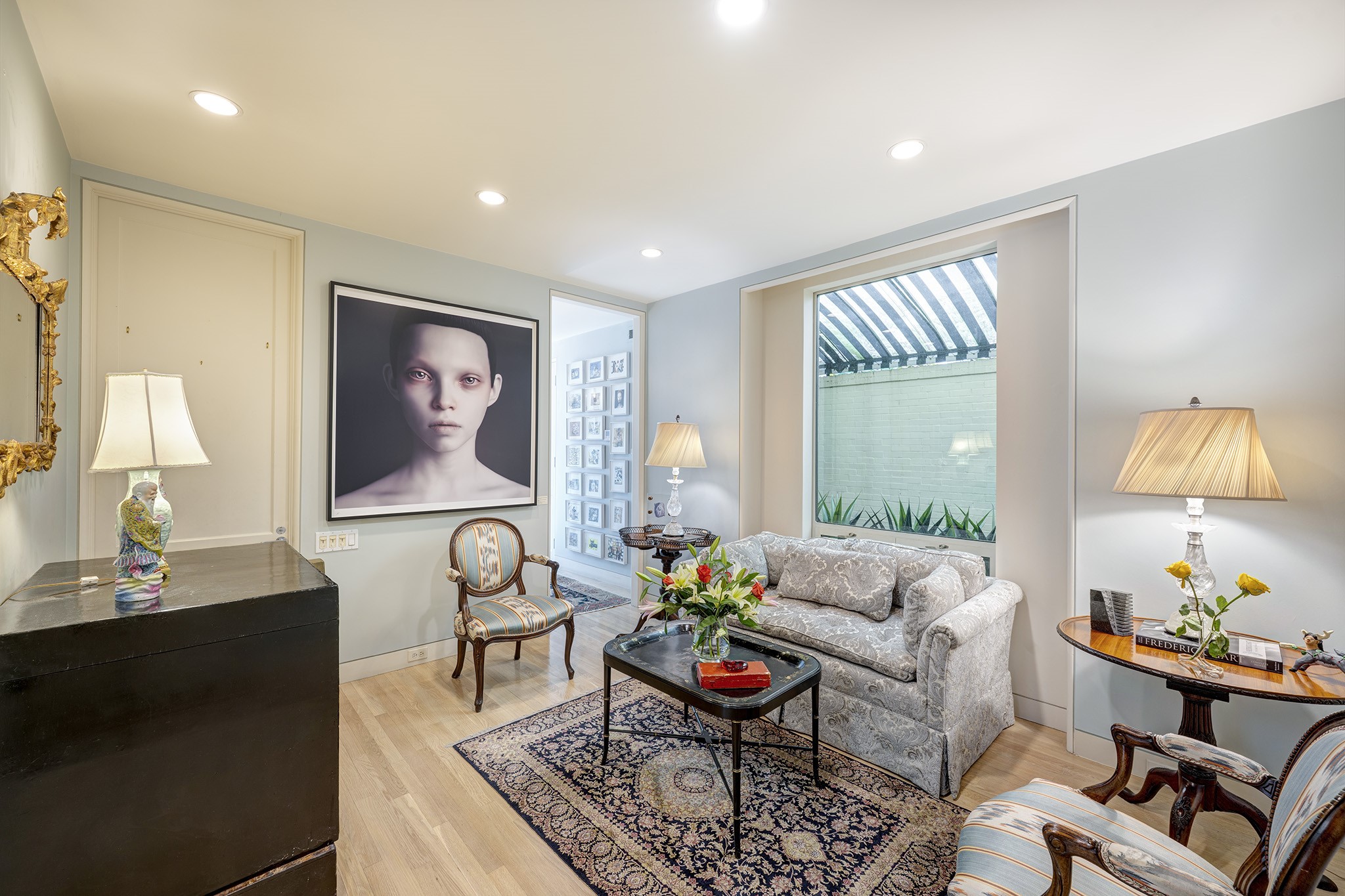 1814 Larchmont Road Houston, TX 77019 - Photo 14 of 29 a living room with furniture and a lamp