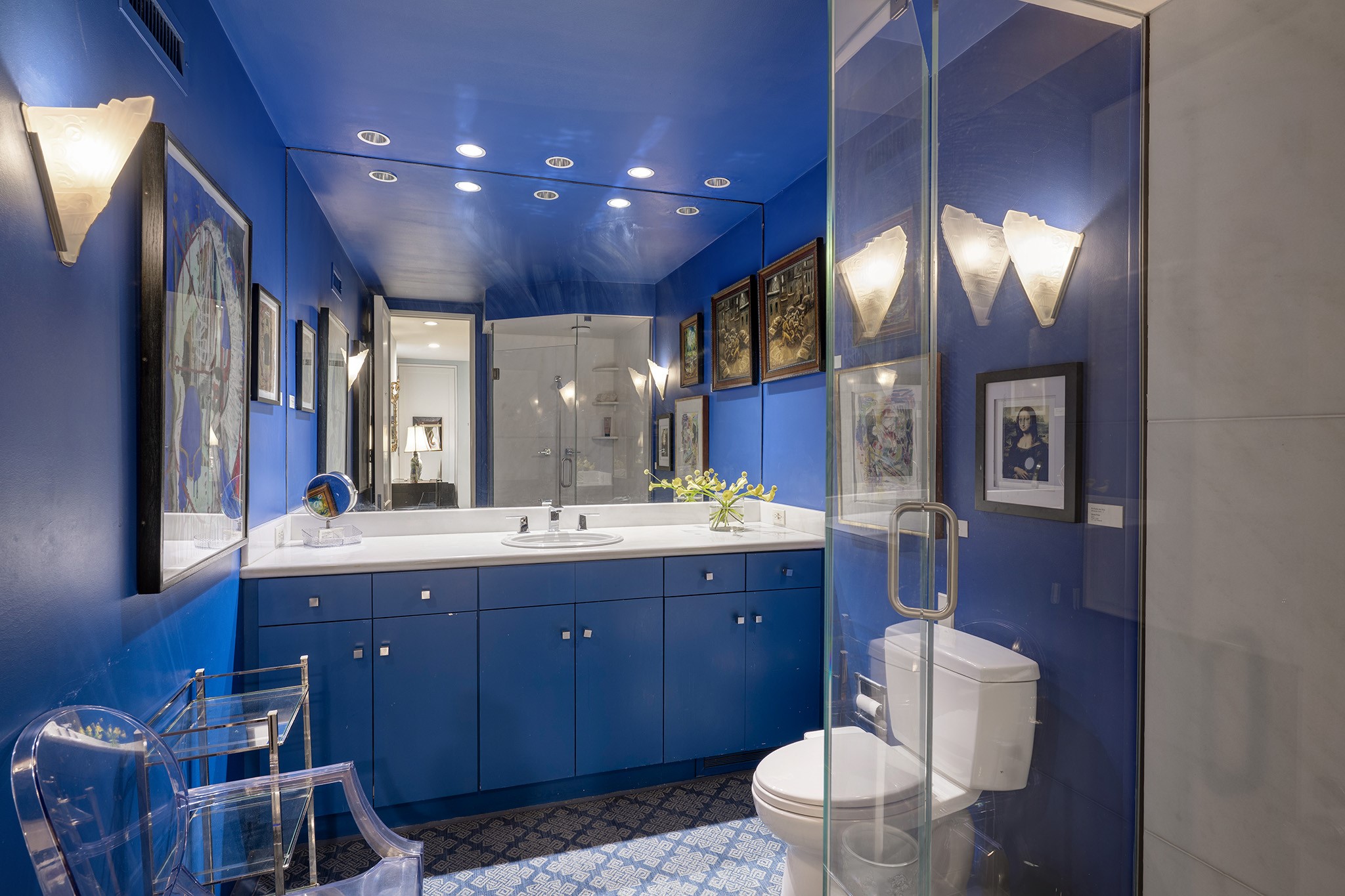 1814 Larchmont Road Houston, TX 77019 - Photo 15 of 29 a spacious bathroom with a toilet sink and mirror