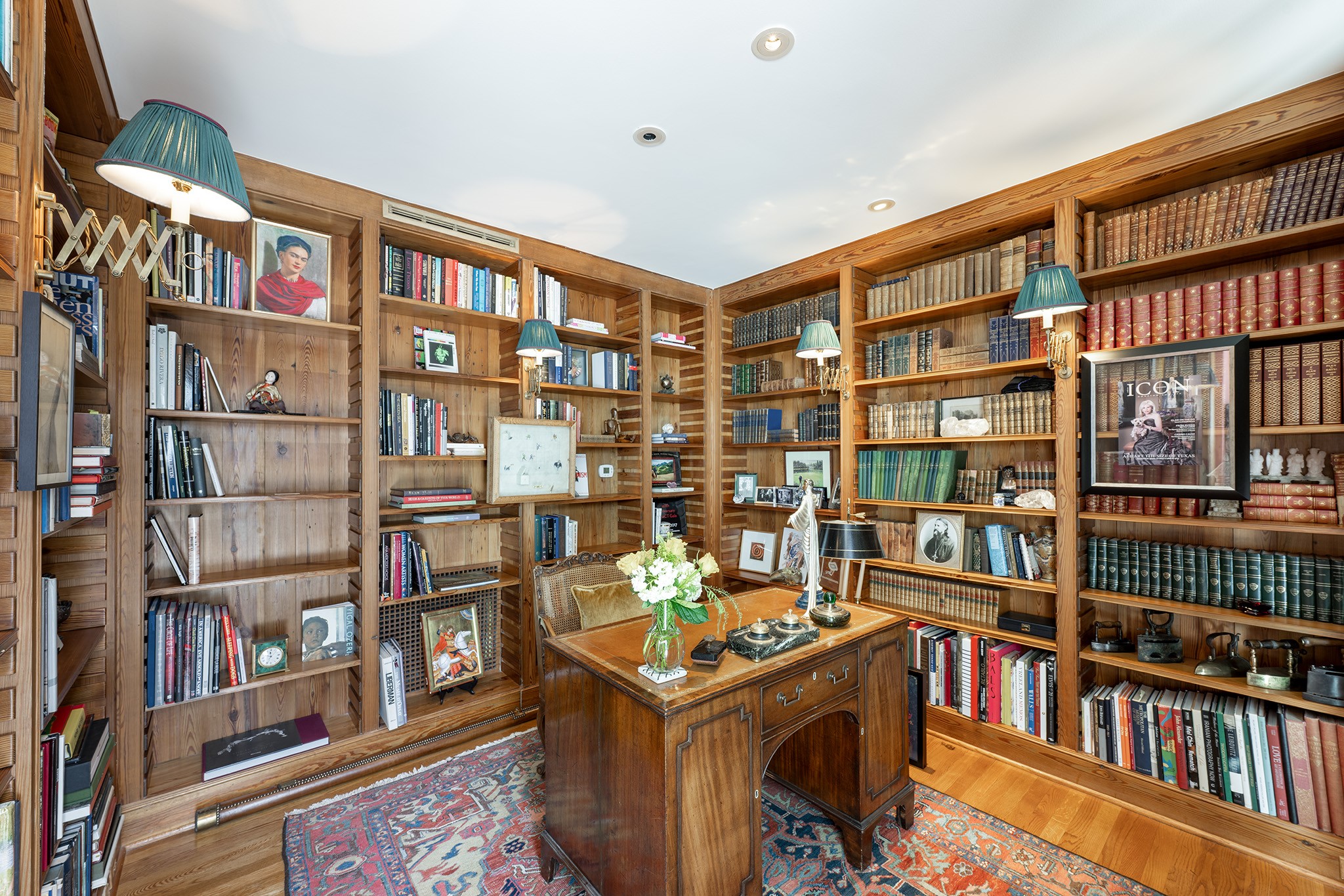 1814 Larchmont Road Houston, TX 77019 - Photo 17 of 29 a view of a book shelf in a room