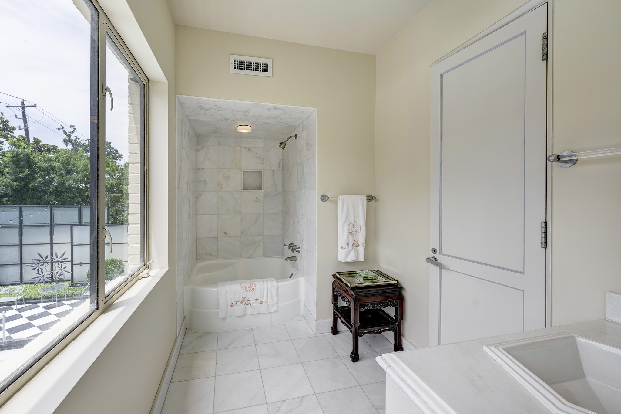 1814 Larchmont Road Houston, TX 77019 - Photo 19 of 29 a bathroom with a tub a sink and a shower