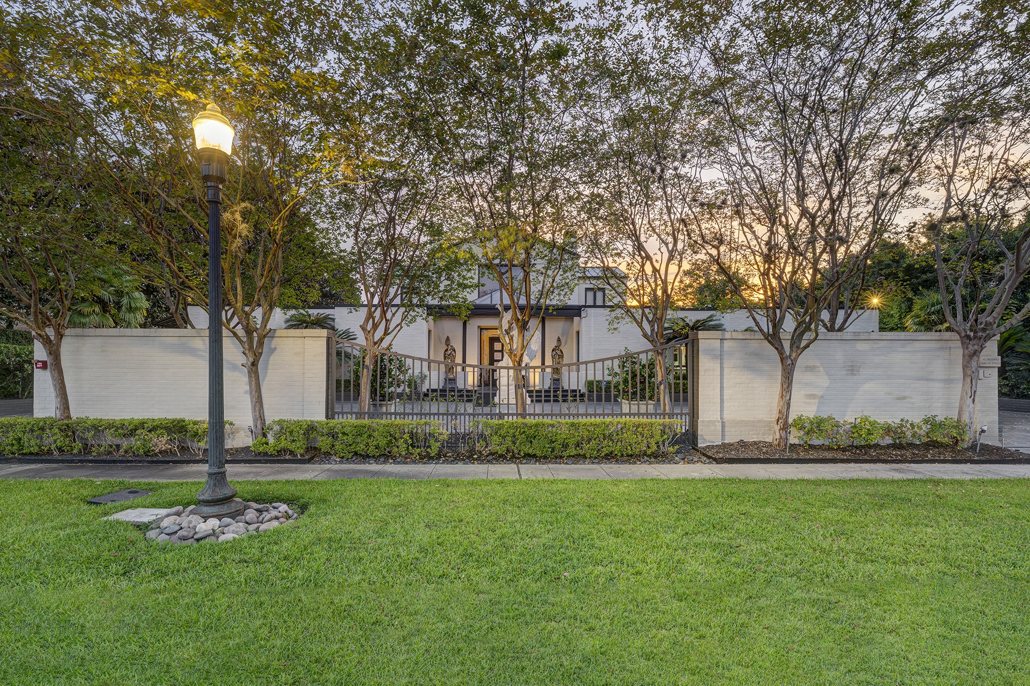 1814 Larchmont Road Houston, TX 77019 - Photo 2 of 29 a front view of a house with a garden
