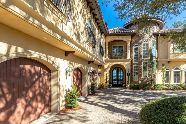 a kitchen with granite countertop a refrigerator and a stove top oven