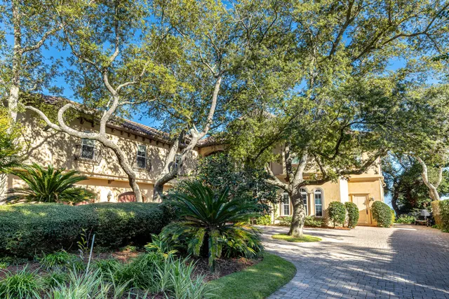 a view of a swimming pool with lounge chairs