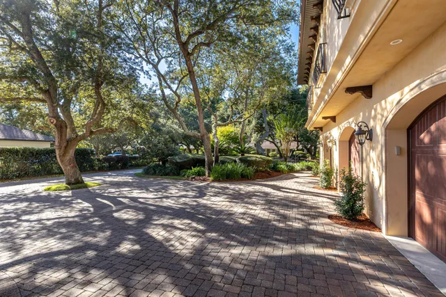 a view of a swimming pool with chair and table