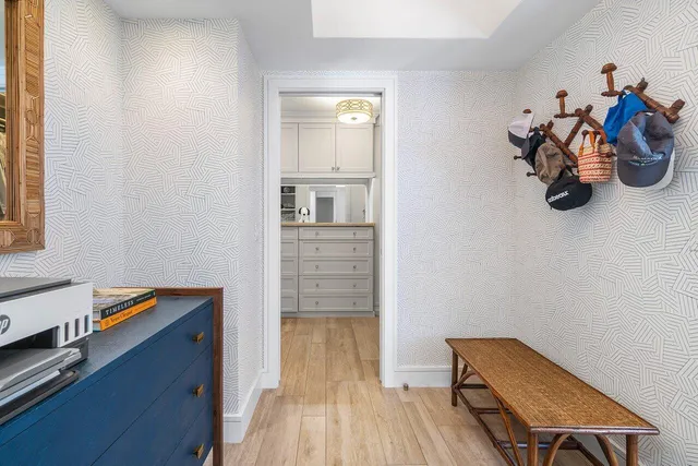 a bedroom with a bed and a table