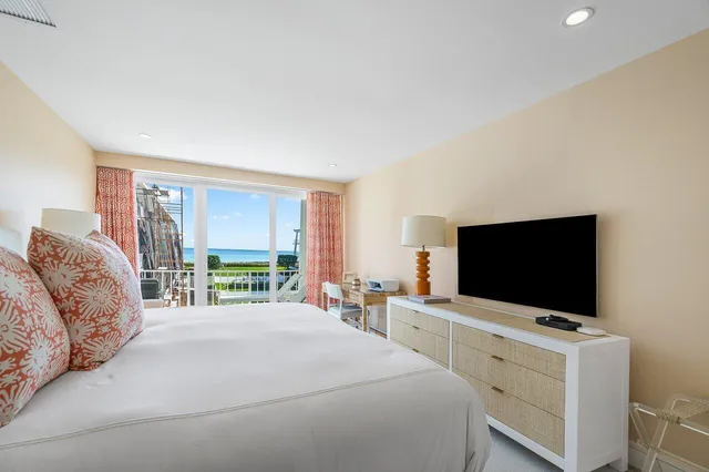 a bathroom with a double vanity sink a mirror and a shower
