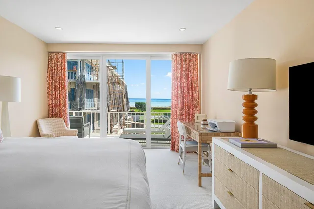 a view of building with swimming pool and outdoor seating