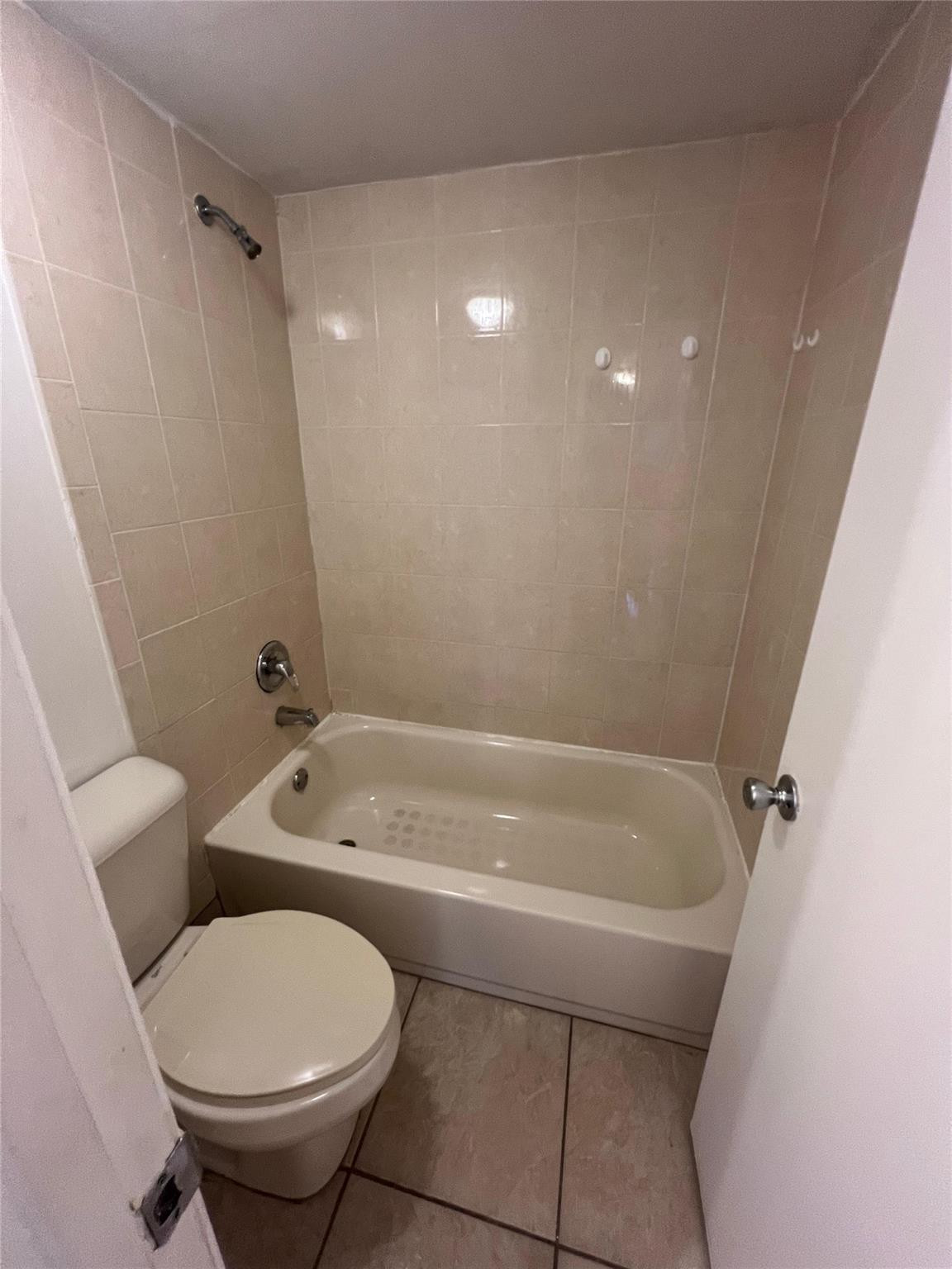 Undisclosed Address Plantation, FL 33324 - Photo 16 of 16 a bathroom with a toilet and a shower