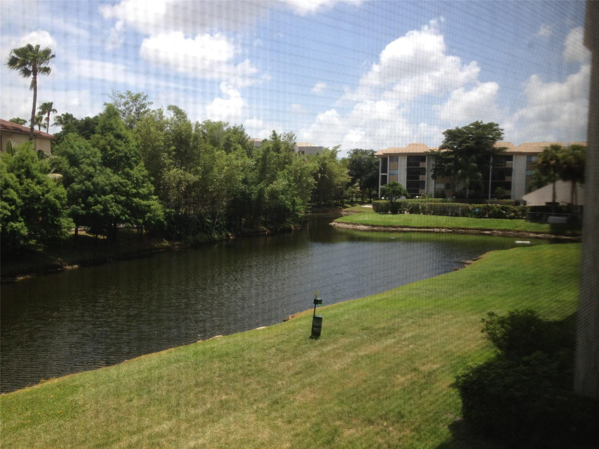 Undisclosed Address Plantation, FL 33324 - Photo 10 of 16 a view of a lake with a big yard